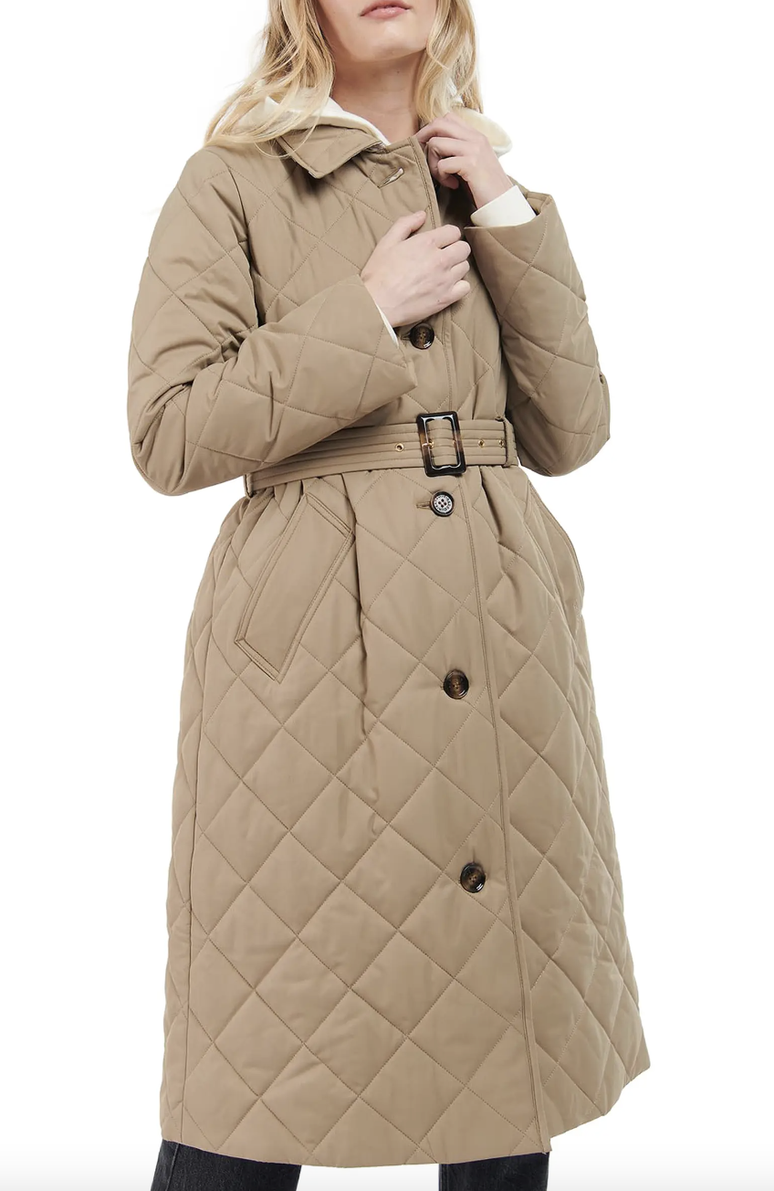 woman wearing light brown Barbour Cordelia Quilted Longline Jacket (Photo via Nordstrom)