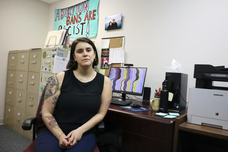 FILE - Katie Quiñonez, executive Director of the Women's Health Center of West Virginia, sits in her office at the clinic in Charleston, W.Va. on June 29, 2022. A new abortion provider, the Women’s Health Center of Maryland, is opening this year in the Democratic-controlled state — just across from deeply conservative West Virginia, where state lawmakers recently passed a near-total abortion ban. (AP Photo/Leah Willingham, File)