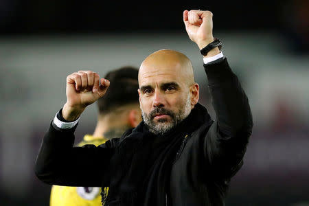 Soccer Football - Premier League - Swansea City vs Manchester City - Liberty Stadium, Swansea, Britain - December 13, 2017 Manchester City manager Pep Guardiola celebrates at the end of the match Action Images via Reuters/Andrew Boyers