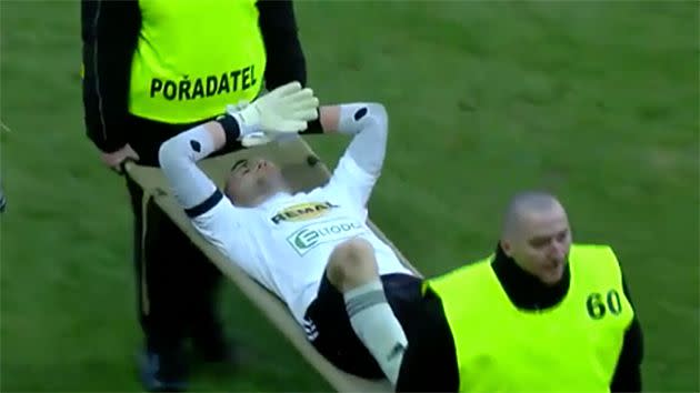 The goalkeeper was stretchered off after the incident. Pic: Youtube