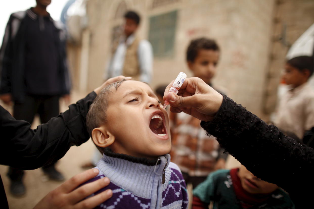 A boy receives polio vaccination drops during a house-to-house vaccination campaign in Yemen's capital, Sanaa, on April 10, 2016. (Photo: Khaled Abdullah / Reuters)