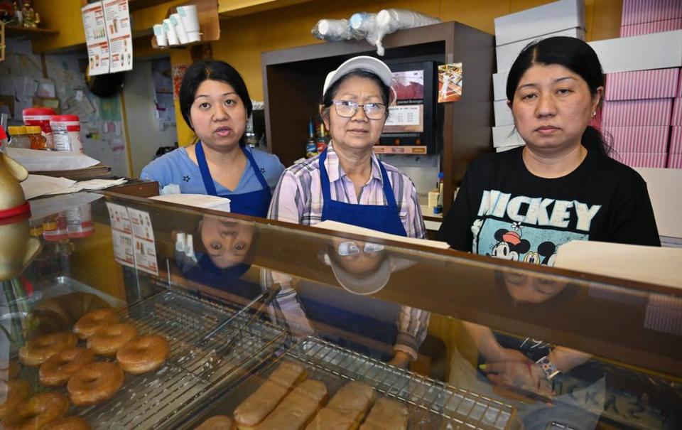 Judy Taing, left, with her mother Lee Taing, center, and sister Katie Taing, right, talk about their impending move after the property owner gave them notice to leave, closing down the family’s Lucky’s Donut House location after over 30 years at Shields and West avenues. Photographed Monday, May 20, 2024.