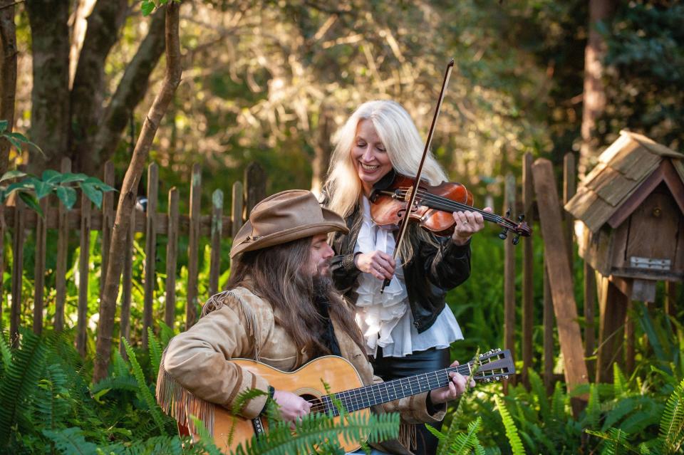 Saylor Dollar, an Americana acoustic-rock band with Dale Dollar (guitar) and Lisa Saylor Dollar (vocals & fiddle), check into Blue Tavern on Saturday, Oct. 14, 2023.