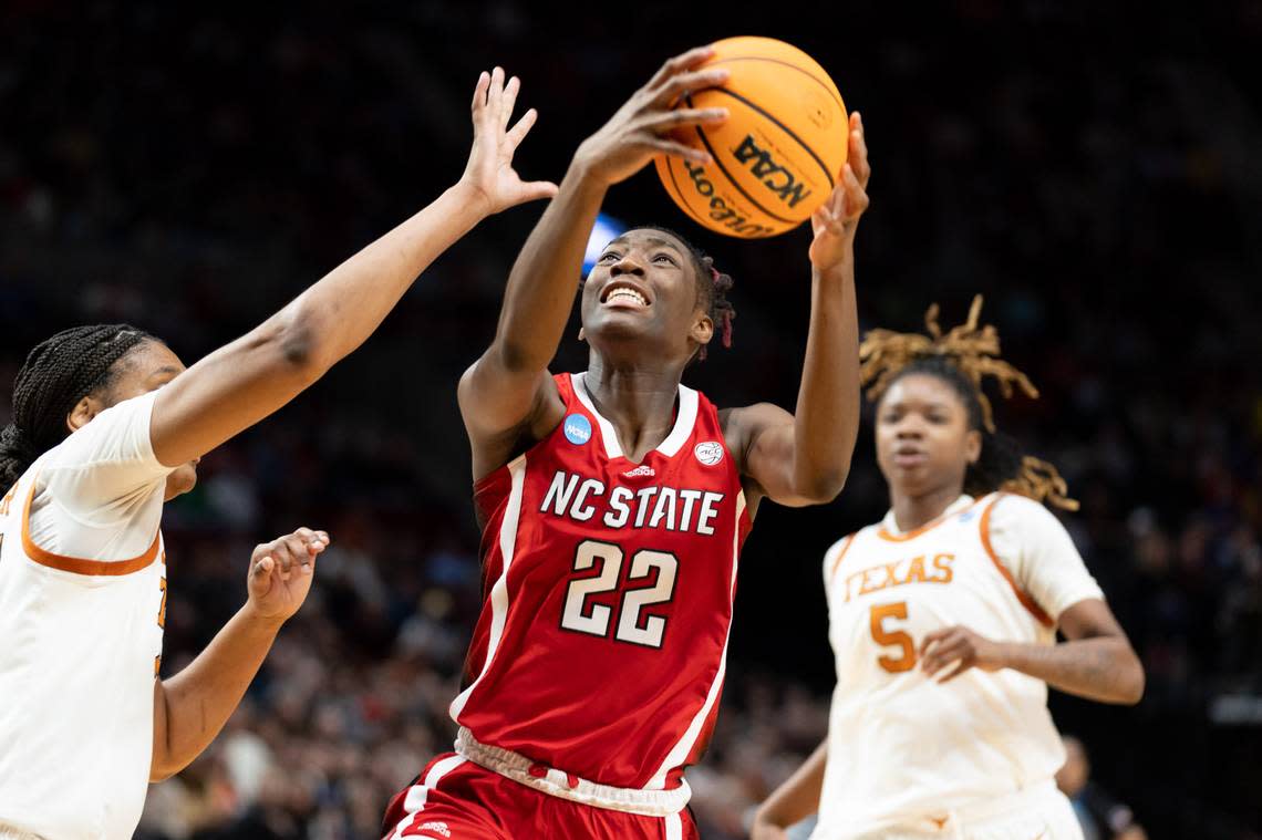 Saniya Rivers drives against a Texas defender as NC State plays Texas at the Moda Center on March 31, 2024.