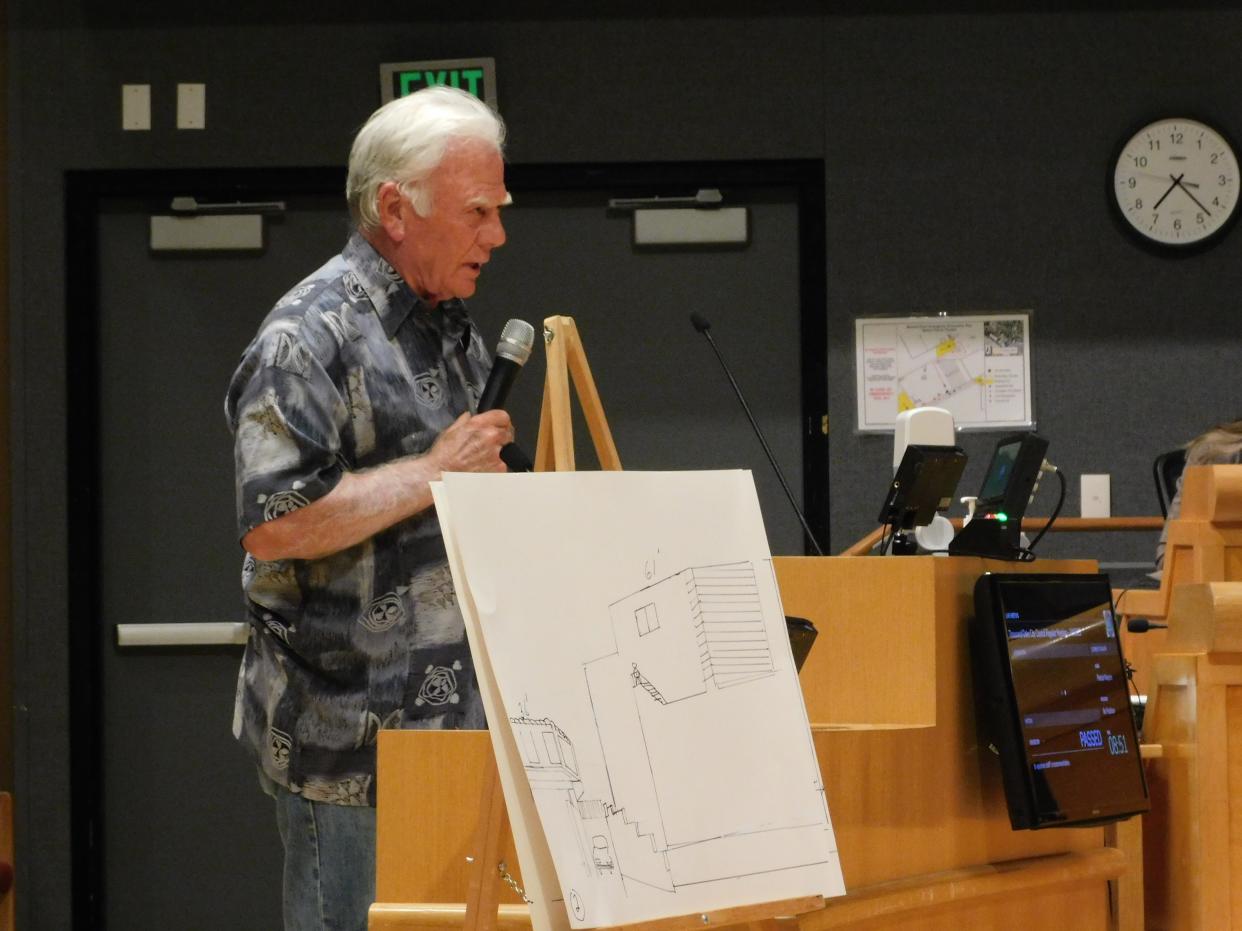 Patrick Naylon tells the Thousand Oaks City Council at its Tuesday meeting that a proposed apartment building on Erbes Road will be much higher than his building at 1800 Foursite Lane, shown at left in his drawing.