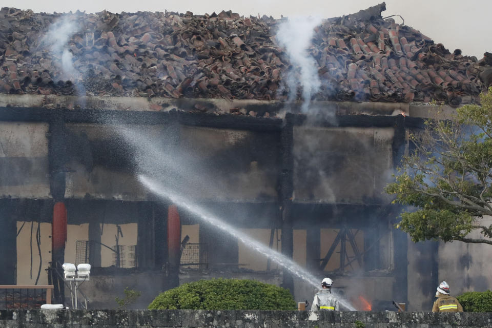 Firefighters try to extinguish a fire at the north hall of Shuri Castle in Naha, Okinawa, southern Japan, Thursday, Oct. 31, 2019. A fire spread among structures at Shuri Castle on Japan's southern island of Okinawa, nearly destroying the UNESCO World Heritage site. (Jun Hirata/Kyodo News via AP)