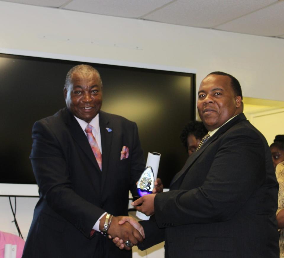 John H. Martin, at left, recognized upon his recent retirement by former H.C. School District 2 Superintendent Martin Wright.