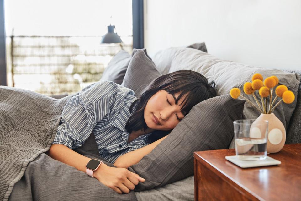 You can sleep with your Fitbit Versa 2 and it will track your deep sleep and REM sleep each night and give you a Sleep Score.