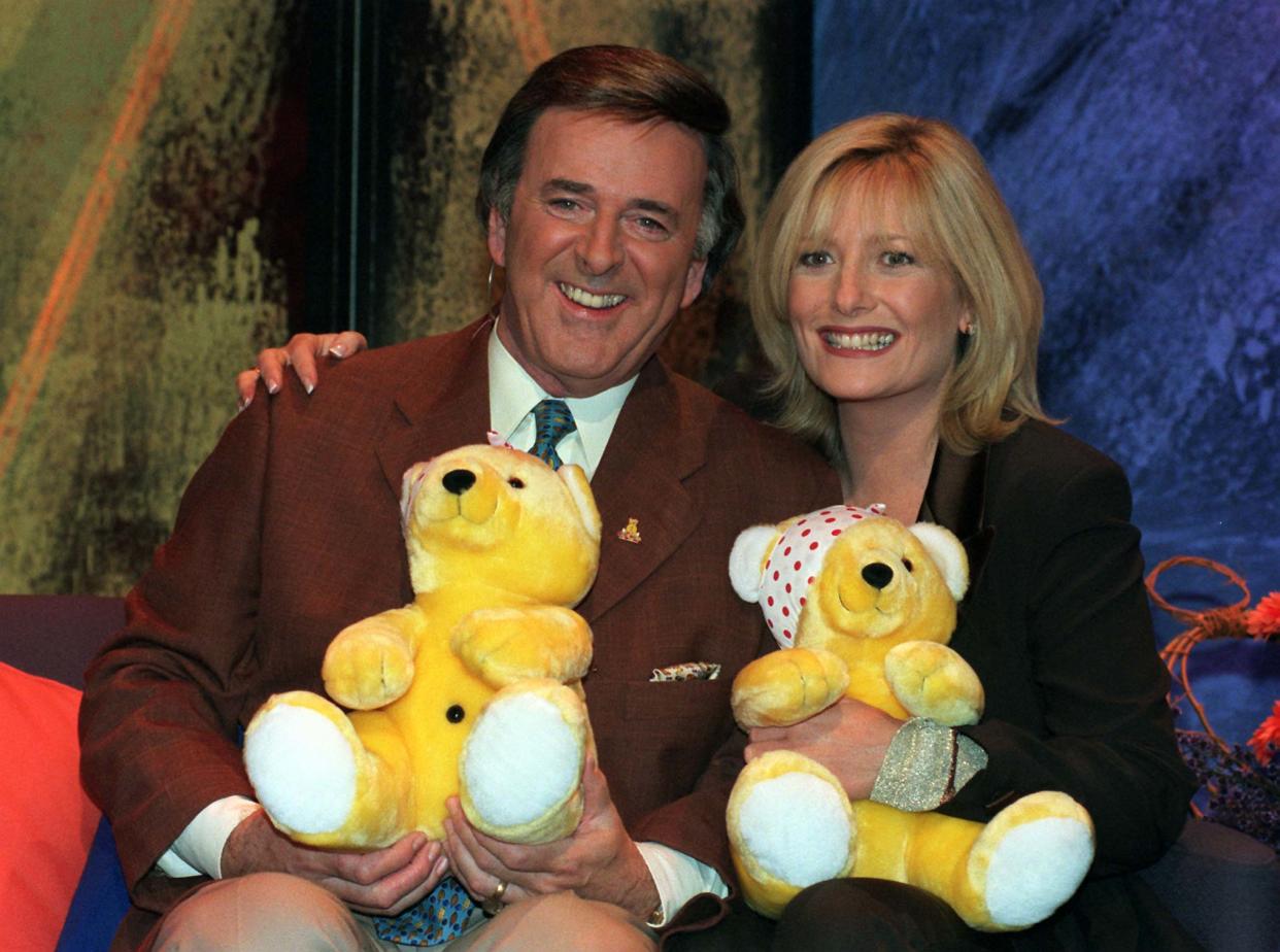 Presenters Gaby Roslin and Terry Wogan during their marathon broadcast to raise money for the BBC Children in Need Appeal tonight (Friday). Photo by Michael Stephens/PA.  * 17/11/2000 Gaby Roslin and Terry Wogan during their marathon broadcast to raise money for the BBC Children in Need Appeal.  Stars from the world of television, pop and sport are taking part in the 21st televised BBC Children in Need Appeal Friday November 17th, 2000. Presenters Wogan and Roslin are hosting the event in the studio  and across the country celebrities and members of the public will help raise much needed funds for the charity.   (Photo by Michael Stephens - PA Images/PA Images via Getty Images)