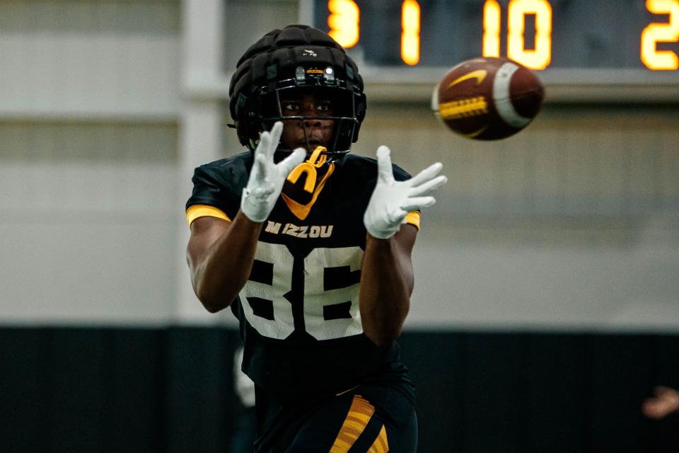 Missouri freshman tight end Jordon Harris opens his arms to catch a football during a training camp practice this August.