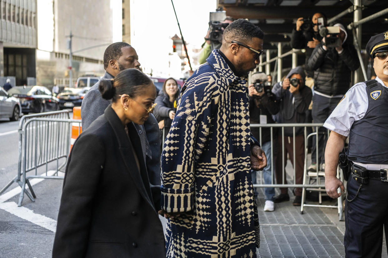 Actor Jonathan Majors and Meagan Good arrive at court on Monday.