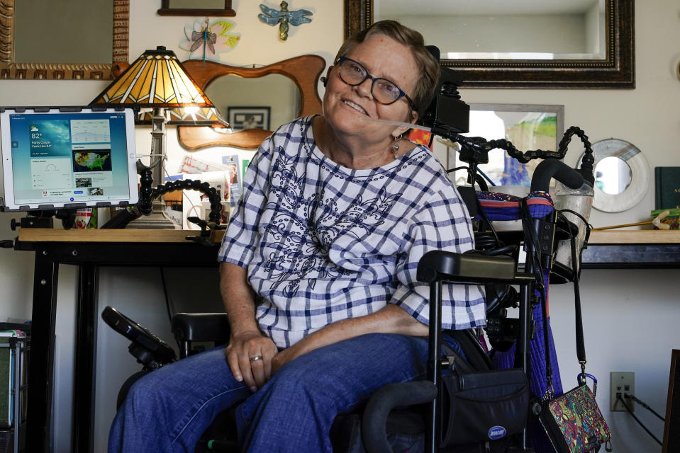 Martha Chambers pose in her apartment Friday, Sept. 2, 2022, in Milwaukee. Wisconsin voters with disabilities are celebrating a win after a federal judge, citing the Voting Rights Act, ruled that they may get assistance returning their ballots. (AP Photo/Morry Gash)