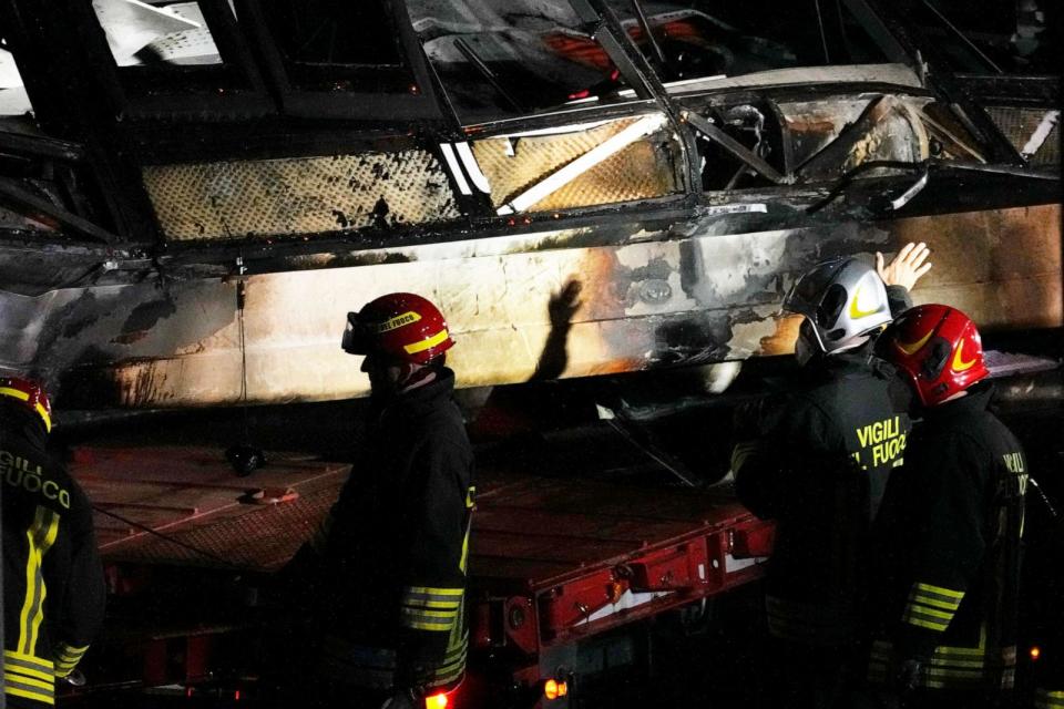 PHOTO: Italian firefighters work at the scene of a passenger bus accident in Mestre, near the city of Venice, Italy, Oct. 4, 2023. The bus fell from an elevated road late Tuesday. (Antonio Calanni/AP)