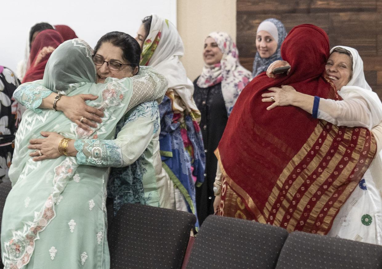 Women greet each other after the Eid celebration at United Islamic Center of Arizona in Glendale on June 4, 2019.  Eid al-Fitr, is a festival marking the end of the one month of fasting by Muslim religion.