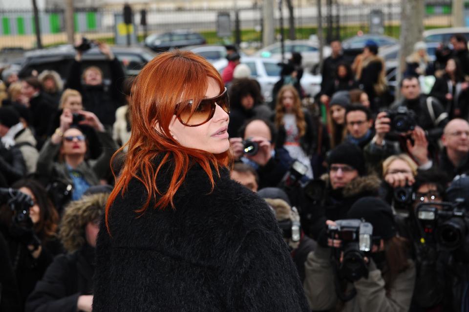 Singer Axelle Red leaves Belgian fashion designer Veronique Leroy's Ready to Wear Fall-Winter 2013-2014 fashion collection presentation, Saturday, March 2, 2013 in Paris. (AP Photo/Zacharie Scheurer)