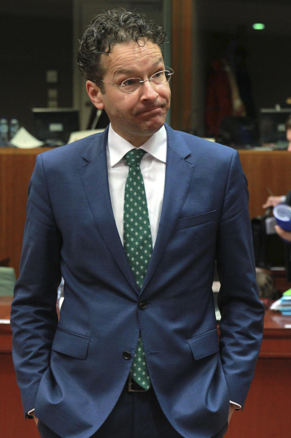 Netherlands' Finance Minister Jeroen Dijsselbloem waits for the start of an EU finance ministers meeting at the European Council building in Brussels, Tuesday, March 11, 2014. The Council prepares the presidency's mandate to finalize negotiations with the European Parliament on the proposal for a single resolution mechanism for banks. (AP Photo/Yves Logghe)