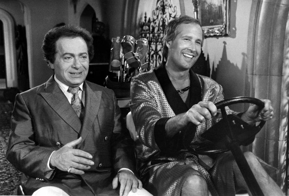 Actor Jackie Mason and Chevy Chase on set of the movie " Caddyshack II " circa 1988.