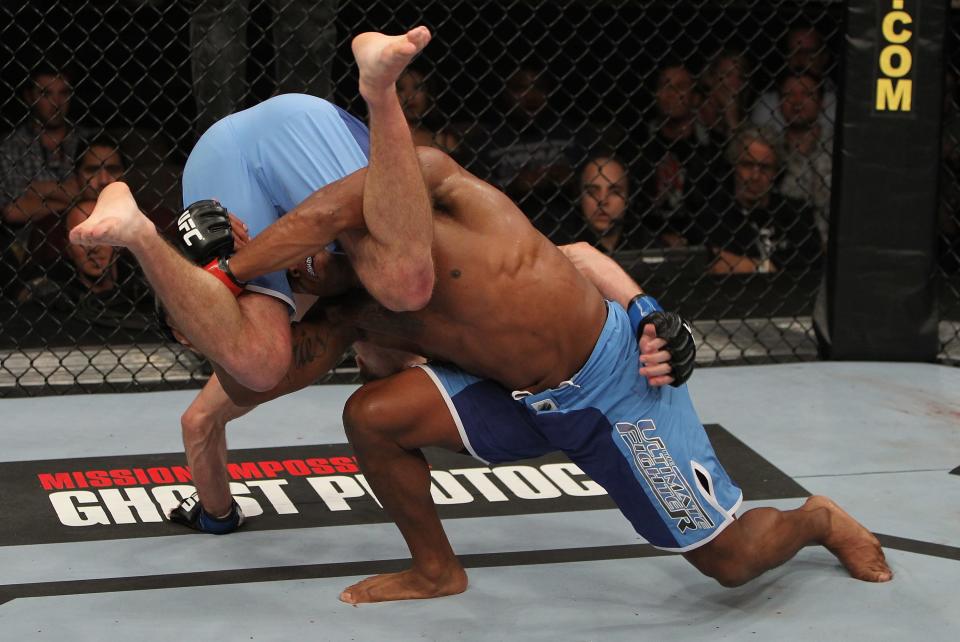 Marcus Brimmage attempts to take down Stephen Bass (right to left) during The Ultimate Fighter 14 Finale at the Pearl Theatre at the Palms Hotel and Casino on December 3, 2011 in Las Vegas, Nevada. (Photo by Josh Hedges/Zuffa LLC/Zuffa LLC via Getty Images)