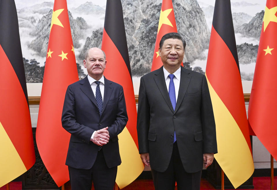 In this photo released by Xinhua News Agency, Chinese President Xi Jinping, right and German Chancellor Olaf Scholz pose for a photo at the Diaoyutai State Guesthouse in Beijing, China, on Tuesday, April 16, 2024. (Xie Huanchi/Xinhua via AP)