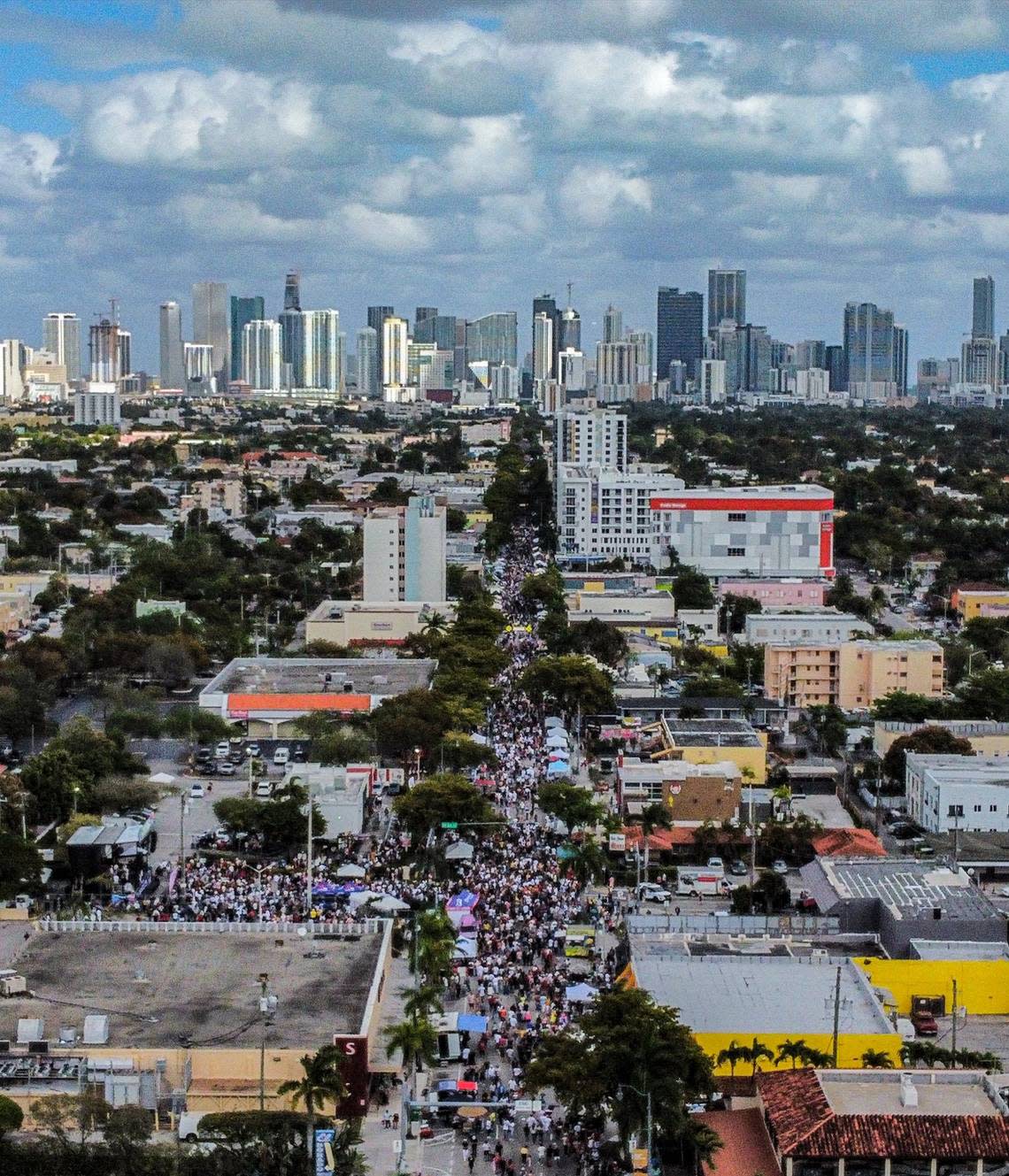 A drone shot of Calle Ocho, where revelers enjoy music and food while vendors hawk their wares down SW 8th Street in Miami’s Little Havana neighborhood.