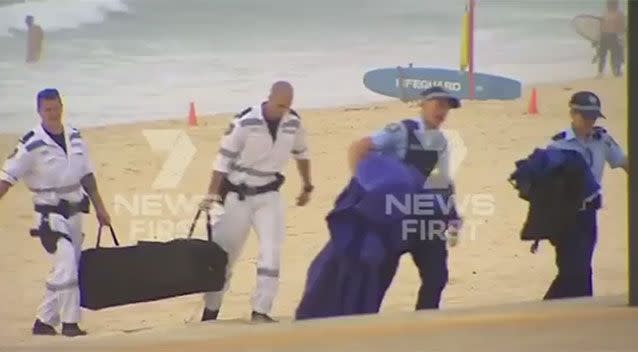 Police approach the area on Maroubra beach where a body was found, believed to be 14-year-old Tui Gallaher who went missing on Thursday. Source: 7 News