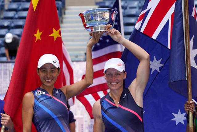 Zhang Shuai and Sam Stosur lift the women's doubles trophy