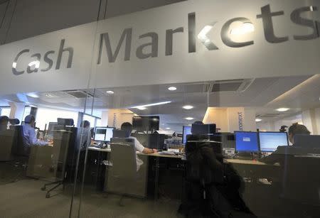 Experts work at their screens in the NYSE Euronext cash markets operations room at the transatlantic stock market operator responsible for the proper functioning of the Paris, Brussels, Amsterdam and Lisbon stock markets in Paris August 19, 2011. REUTERS/Philippe Wojazer