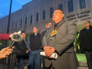 Oglala Sioux Tribe President Frank Star Comes speaks to reporters Feb. 2023 after the first day of hearings in Oglala Sioux Tribe v. United States. The tribe alleges that the United States has failed their treaty obligations by providing inadequate law enforcement funding. (Photo by Shalom Baer Gee, Rapid City Journal)