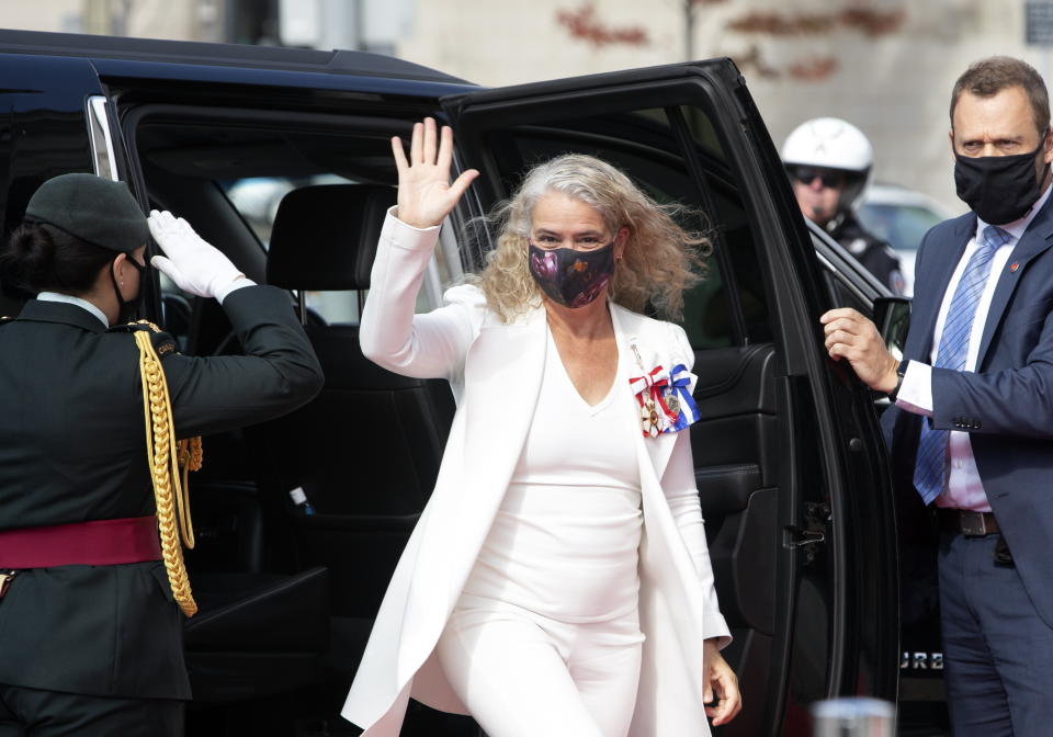 Gov. Gen. Julie Payette waves as she arrives outside the Senate to deliver the throne speech, Wednesday, September 23, 2020 in Ottawa. (Fred Chartrand/The Canadian Press via AP)