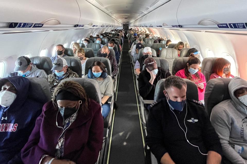 FILE -- A fully-booked Jet Blue flight from Washington National Airport to Orlando, Fla., Feb. 24, 2021. American Airlines and Southwest Airlines, the last two major U.S. airlines to report first-quarter earnings, were optimistic about a rebound in air travel. (Erin Schaff/The New York Times)