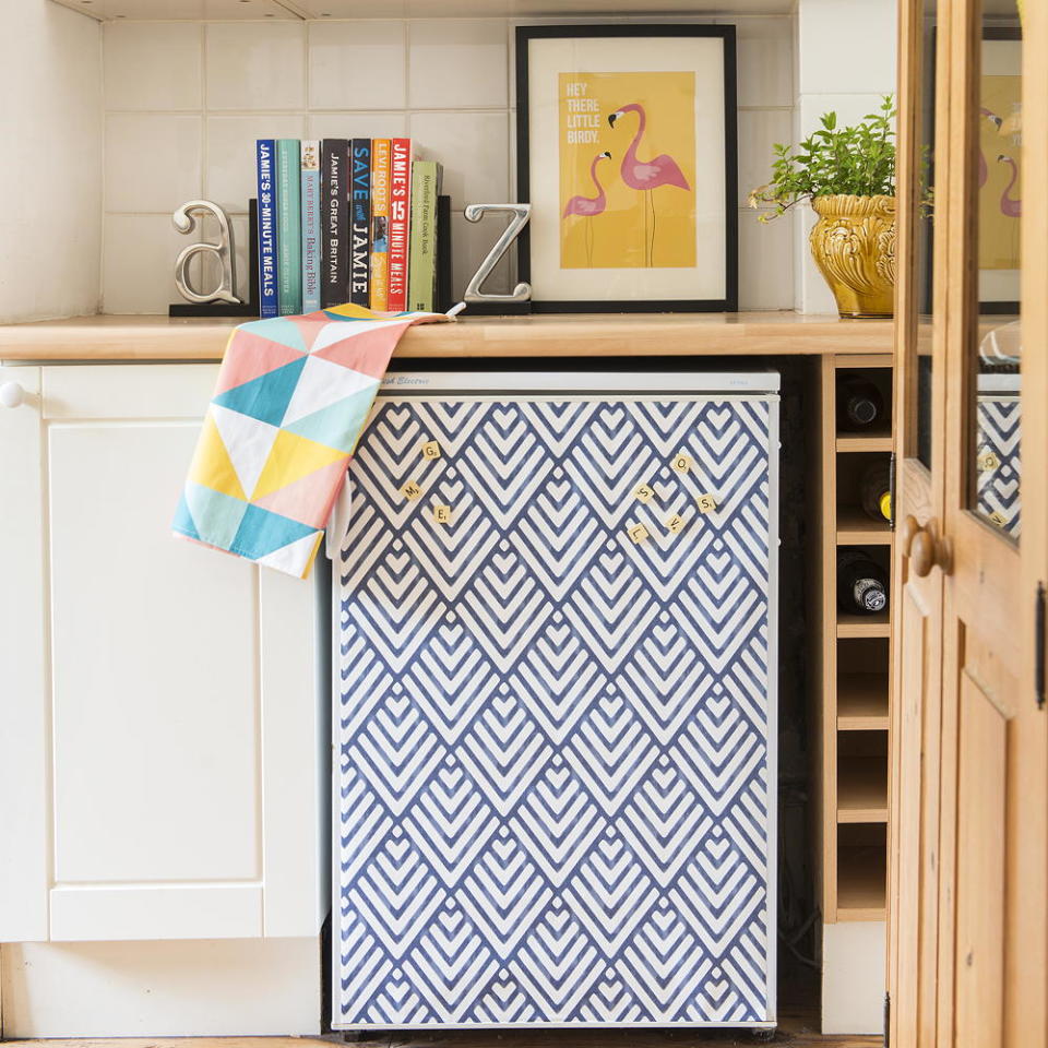 <p> If you can't afford a swanky Smeg fridge but are desperate to give your boring-looking appliance a splash of colour, why not get crafty with a can of spray paint – a fridge hack that has been used above.  </p> <p> Alternatively, for a less permanent option cover the front of the household appliance with a leftover roll of wallpaper attached with double sided sticky tape. </p>