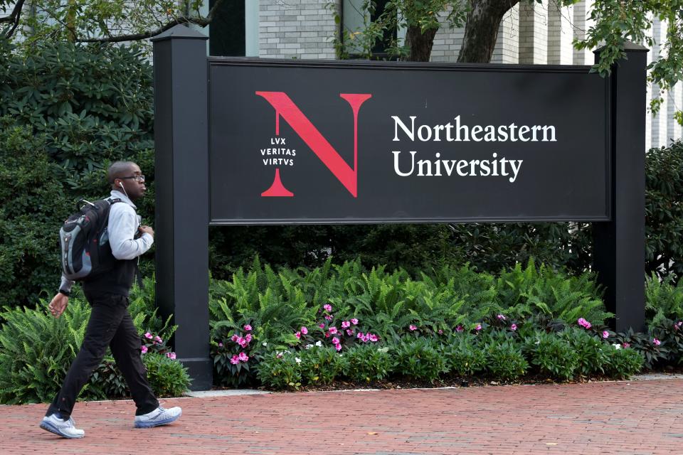 A student walks through Krentzman Quadrangle on Northeastern University Campus on September 14, 2022 in Boston, Massachusetts.