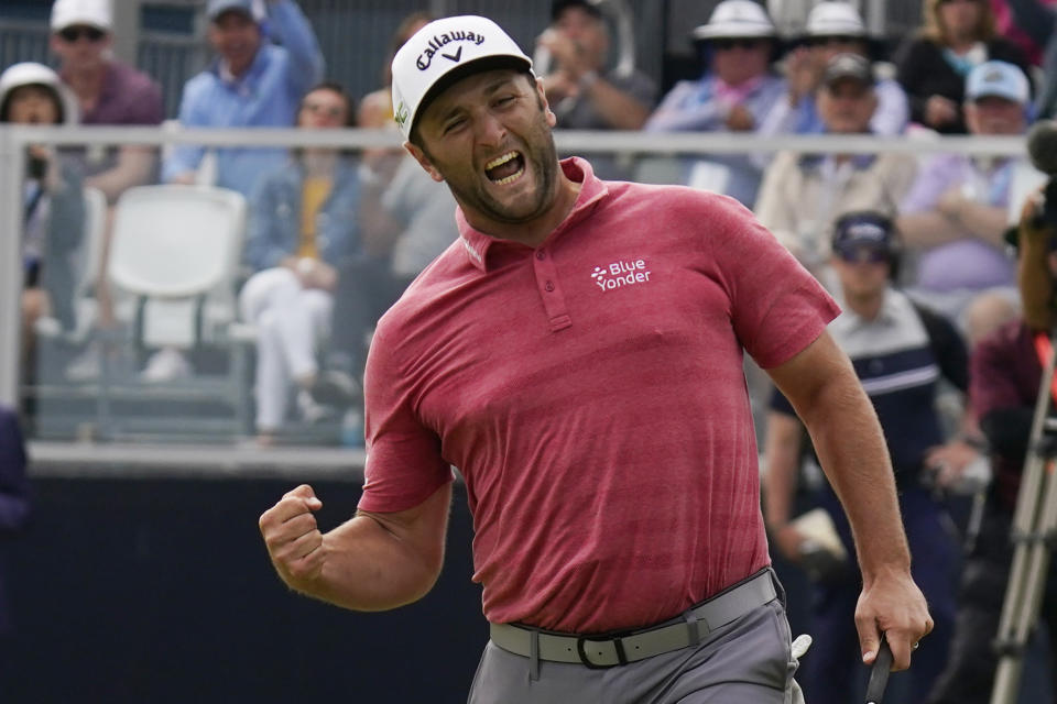 Jon Rahm, of Spain, reacts to making his birdie putt on the 18th green during the final round of the U.S. Open Golf Championship, Sunday, June 20, 2021, at Torrey Pines Golf Course in San Diego. (AP Photo/Gregory Bull)