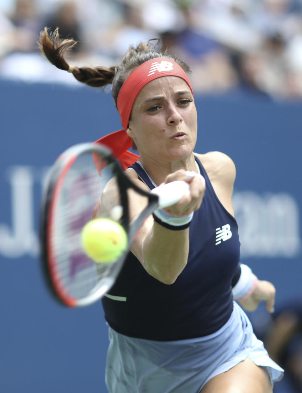 Nicole Gibbs, of the United States, returns a shot to Simona Halep, of Romania, during the first round of the US Open tennis tournament Tuesday, Aug. 27, 2019, in New York. (AP Photo/Kevin Hagen)