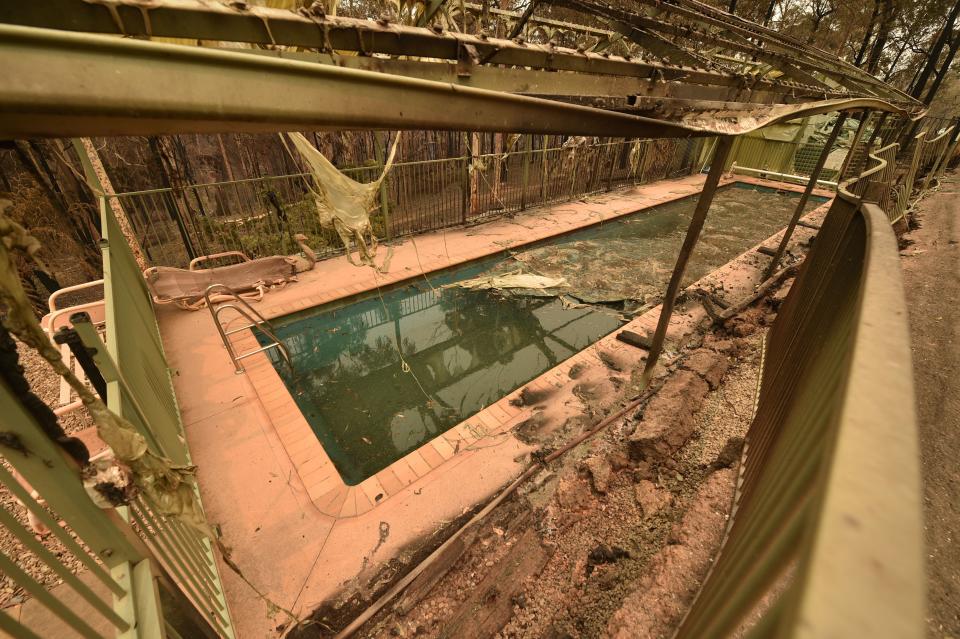 A swimming pool in the remains of a house destroyed by bushfires is seen just outside Batemans Bay in New South Wales on Jan. 2, 2020. (Photo by PETER PARKS/AFP via Getty Images)