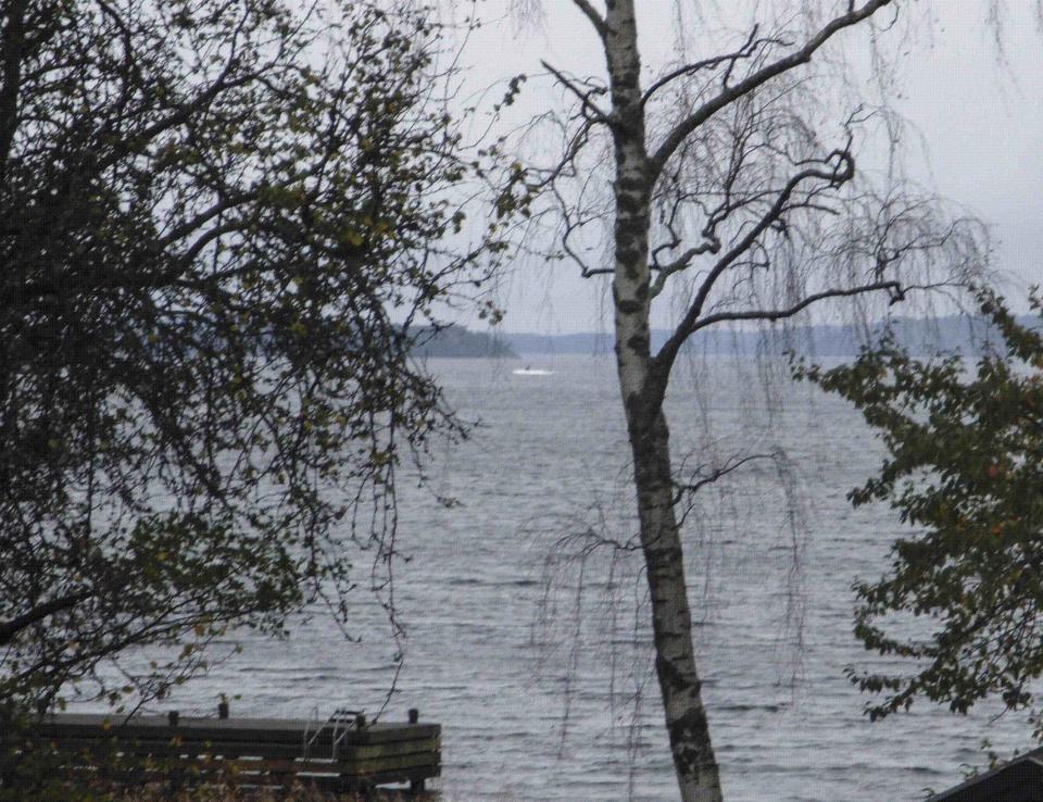 REFILE - UPDATING CAPTION This amateur photo made available on October 19, 2014 by the Swedish Defence Ministry shows an object (top C) in the sea near Stockholm. Sweden released the grainy photo of a mysterious vessel in Stockholm's archipelago, as the military hunted for a foreign submarine or divers in the country's biggest such mobilization since the Cold War. The search in the Baltic Sea less than 30 miles (50 km) from Stockholm began on Friday and reawakened memories of the final years of the Cold War when Sweden repeatedly sought out suspected Soviet submarines along its coast with depth charges. The military showed one picture of what appeared to be a craft surrounded by white ripples. The witness who took the photograph said the vessel then submerged -- one of three sightings that the military said were credible reports. REUTERS/Swedish Defence Ministry/Handout/TT News Agency (SWEDEN - Tags: MARITIME POLITICS MILITARY TPX IMAGES OF THE DAY) ATTENTION EDITORS - THIS PICTURE WAS PROVIDED BY A THIRD PARTY. REUTERS IS UNABLE TO INDEPENDENTLY VERIFY THE AUTHENTICITY, CONTENT, LOCATION OR DATE OF THIS IMAGE. FOR EDITORIAL USE ONLY. NOT FOR SALE FOR MARKETING OR ADVERTISING CAMPAIGNS. THIS PICTURE IS DISTRIBUTED EXACTLY AS RECEIVED BY REUTERS, AS A SERVICE TO CLIENTS. NO SALES. NO ARCHIVES. SWEDEN OUT. NO COMMERCIAL OR EDITORIAL SALES IN SWEDEN