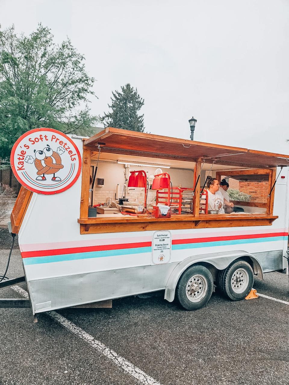 Katie Smith’s husband, Spencer, converted an empty shell of a trailer into his wife’s new Katie’s Soft Pretzels food trailer.