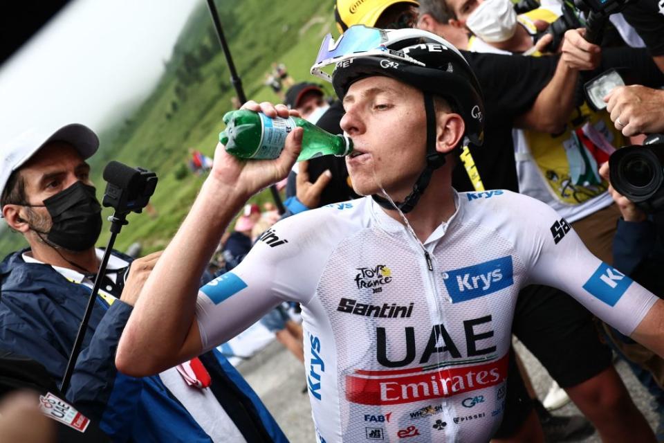 UAE Team Emirates Slovenian rider Tadej Pogacar wearing the best young riders white jersey drinks water as he celebrates winning the 6th stage of the 110th edition of the Tour de France cycling race 145 km between Tarbes and CauteretsCambasque in the Pyrenees mountains in southwestern France on July 6 2023 Photo by AnneChristine POUJOULAT  POOL  AFP Photo by ANNECHRISTINE POUJOULATPOOLAFP via Getty Images