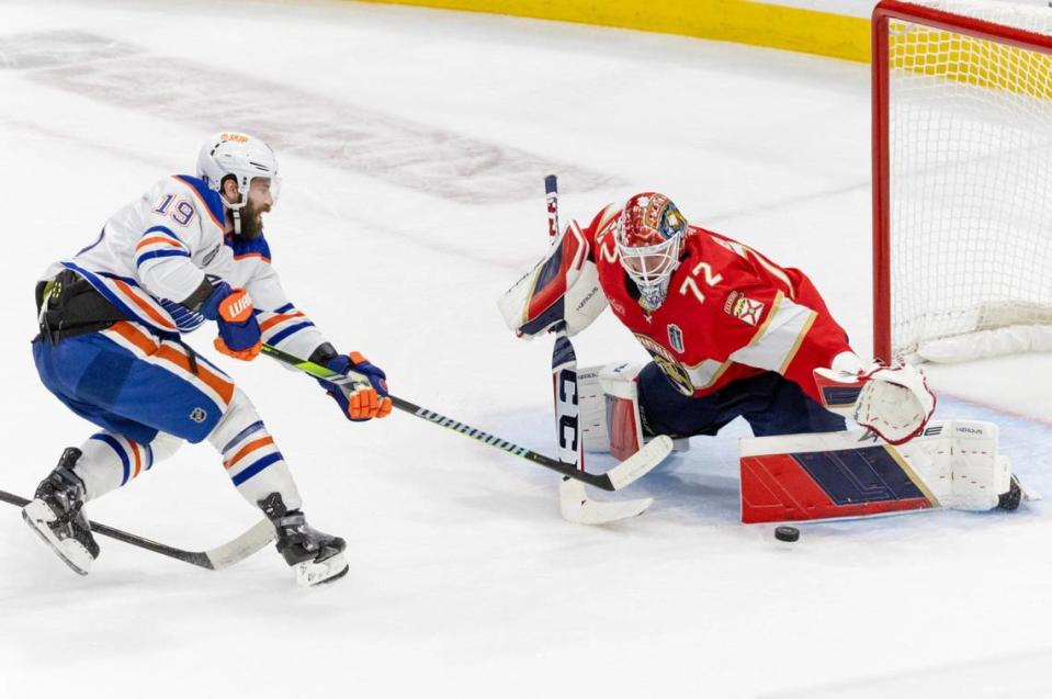 Florida Panthers goaltender Sergei Bobrovsky (72) blocks a shot from Edmonton Oilers center Adam Henrique (19) during the first period of Game 1 of the NHL Stanley Cup Final at the Amerant Bank Arena on Saturday, June 8, 2024, in Sunrise, Fla.