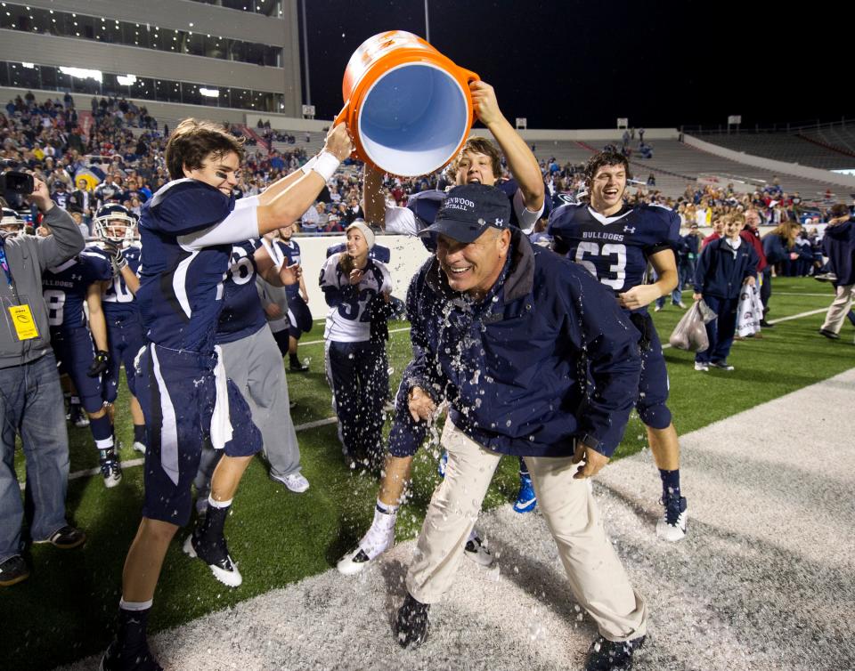 Greenwood head coach Rick Jones, center, is doused with ice water by his players following their 53-11 victory over Batesville in the Class 5A championship football game Dec. 3, 2011, in Little Rock, Ark.