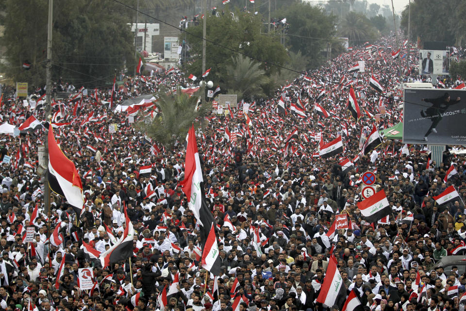 FILE - Followers of Shiite cleric Muqtada al-Sadr gather in Baghdad, Iraq, Jan. 24, 2020. Thousands of supporters of an influential, radical Shiite cleric gathered Friday in central Baghdad for a rally to demand that American troops leave the country. Twenty years after the U.S. invaded Iraq, in blinding explosions of shock and awe, American forces remain in the country in what has become a small, but consistent presence to ensure an ongoing relationship with a key military and diplomatic partner in the Middle East. (AP Photo/File)