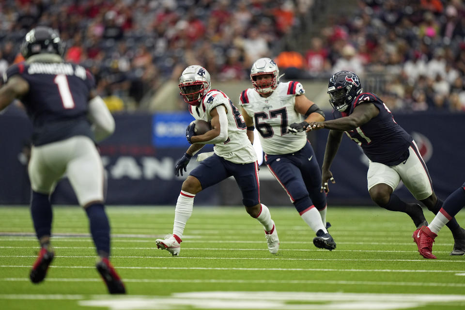 New England Patriots wide receiver Kendrick Bourne (84) catches a pass for a gain as Houston Texans linebacker Kamu Grugier-Hill (51) defends during the first half of an NFL football game Sunday, Oct. 10, 2021, in Houston. (AP Photo/Eric Christian Smith)