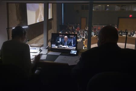 Interpreters work as Egyptian Foreign Minister Sameh Shoukry speaks during a United Nations Security Council meeting about the situation in Libya in the Manhattan borough of New York February 18, 2015. REUTERS/Carlo Allegri