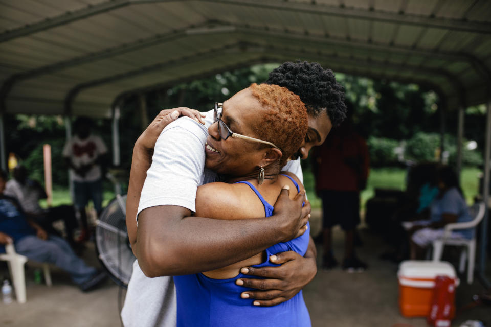 son and mother hugging