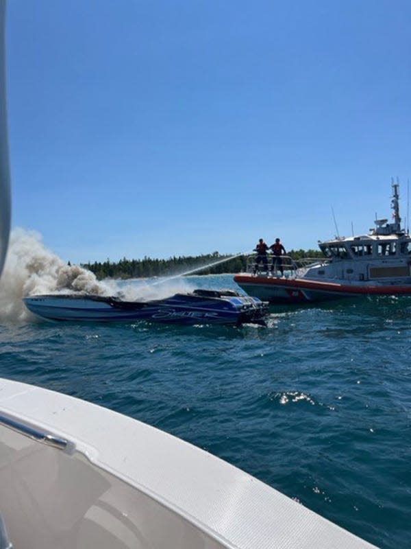 Charlevoix Station’s Coast Guard assist with a power boat fire on Saturday near Charlevoix.