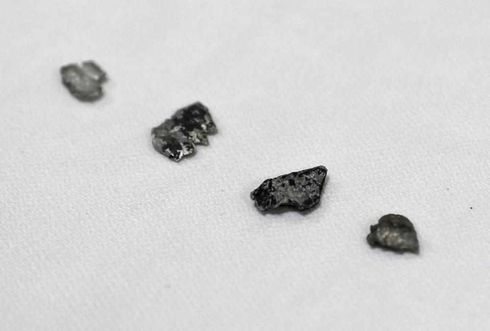 Pieces of aluminium and composite debris that the U.S. Navy says came from a limpet mine attack on a Japanese-owned oil tanker are shown to journalists at a 5th Fleet base, during a trip organized by the Navy for journalists, near Fujairah, United Arab Emirates, Wednesday, June 19, 2019. Cmdr. Sean Kido of the U.S. Navy's 5th Fleet said Wednesday that the limpet mine used on a Japanese-owned oil tanker last week "bears a striking resemblance" to similar Iranian mines. (AP Photo/Kamran Jebreili)