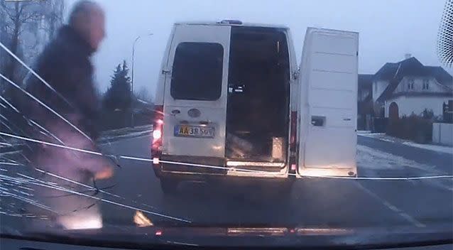 The van driver smashes the other vehicle's windscreen with an axe. Picture: LiveLeak