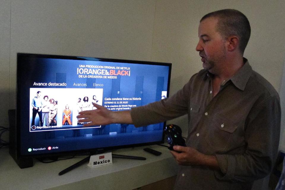 In this photo taken Wednesday, July 10, 2013, Chris Jaffee, Netflix VP of Product Innovation, debuts the new series "Orange is the new black" in Los Gatos, Calif. (AP Photo/Michael Liedtke)