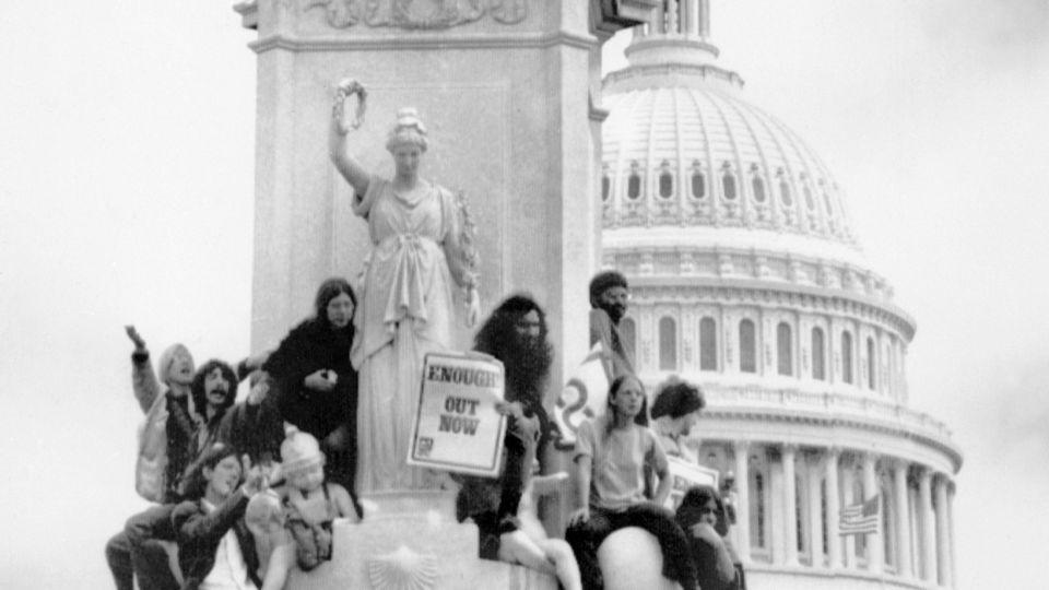 American youths waving Vietcong flag and portrait of Chinese leader Mao Zedong stage a rally on April 25, 1971 in front of the Capitol in Washington, DC protesting United States military involvement in the Vietnam War. - AFP/Getty Images