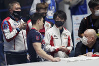 Kohei Uchimura of Japan, center right, chats with Russian team members after he wrote an autograph on a T-shirt at the end of an international gymnastics meet in Tokyo on Sunday, Nov. 8, 2020. Three-time Olympic gold-medal gymnast Uchimura wants the postponed Tokyo Olympics to happen in just under nine months. But he's also talked openly about the skepticism in Japan where enthusiasm is muted by health risks, billions of dollars in taxpayer bills, and questions why the Games are a priority amid a pandemic. (AP Photo/Hiro Komae)